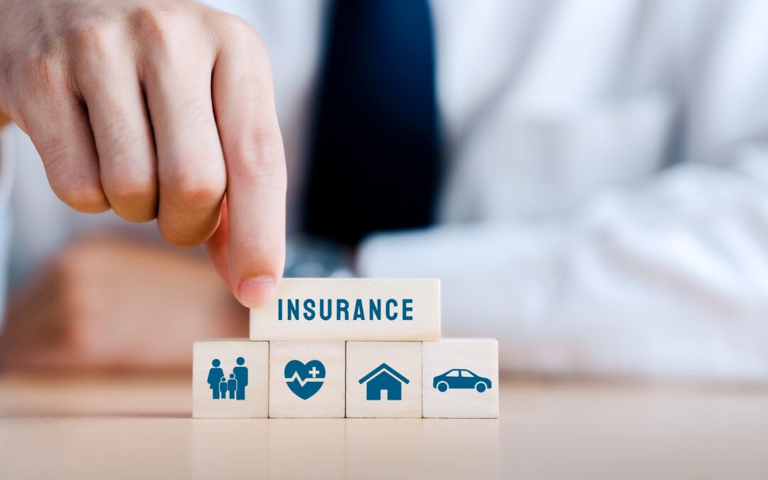Wooden blocks showing family, health, home and car insurance